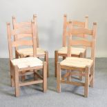 A set of four modern beech dining chairs