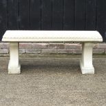 A reconstituted stone garden bench,