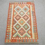 A kelim rug, with diamond pattern designs,