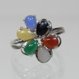 An 18 carat white gold and coloured jade ring, boxed,