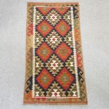 A kelim runner, with all over diamond pattern,