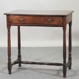An 18th century oak side table,