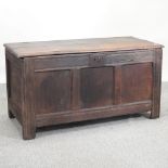 An 18th century oak panelled coffer,