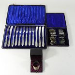 A set of twelve silver coffee spoons, cased, together with a silver napkin ring, cased,