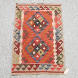 A kelim rug, with two central diamonds,