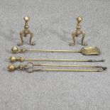 A pair of brass claw and ball mounted fire dogs, 22cm high,