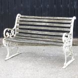 A Victorian style garden bench, with dolphin supports,