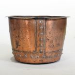 An antique copper copper, with riveted decoration,