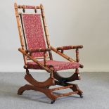 An early 20th century American walnut rocking chair