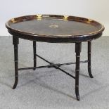 A Regency style simulated walnut butler's tray on stand,