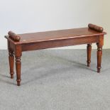 A bespoke made Regency style oak window seat, on turned legs,