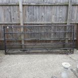 A pair of metal five bar farm gates,
