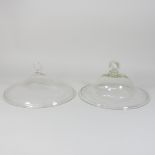 A near pair of 19th century glass lids,