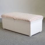 A white painted pine trunk, with an upholstered lid,