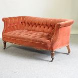 A Victorian red upholstered button back chesterfield settee,