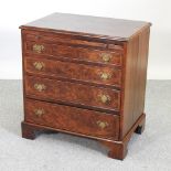 An 18th century style burr walnut chest, of small proportions, fitted with a brushing slide,