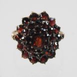 A large unmarked garnet cluster ring, size O,