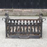 A black painted iron fire grate,