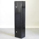 A metal gun cabinet, with keys,