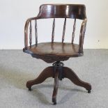 An early 20th century swivel desk chair
