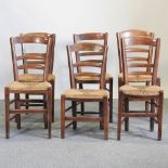 A near set of six early 20th century ash country rush seated dining chairs