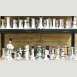 A large collection of mainly early 20th century porcelain candlesticks,