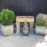 A pair of reconstituted stone planters, together with a reconstituted stone model of a rabbit,