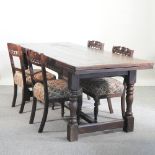 An 18th century style oak draw leaf refectory table, 310 x 87cm overall,