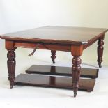 A late Victorian mahogany wind out extending dining table, with three additional leaves,