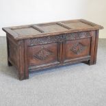 An 18th century carved oak coffer,
