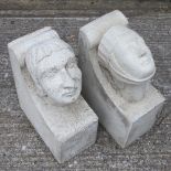 A near pair of medieval style reconstituted stone corbels, each in the form of a merchant's head,