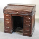 An early 20th century Lebus oak roll top desk,