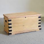 An antique pine and metal bound trunk,