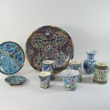 A collection of Persian tin glazed Iznik pottery, to include a large blue dish,