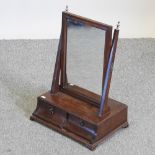 A 19th century swing frame toiletry mirror, containing two drawers,