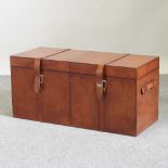 A modern brown leather trunk,