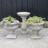 A pair of reconstituted stone garden planters, together with a bird bath,