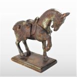 A metal Tang style model of a horse, 24cm high, together with a smaller wooden Tang style horse,
