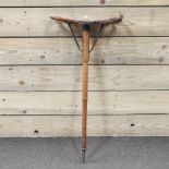 A vintage wooden shooting stick