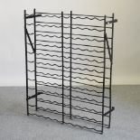 A black painted iron wine rack,