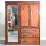 An Edwardian mahogany combination wardrobe,