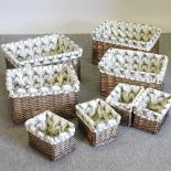 A set of four graduated wicker baskets, with stag print liners, largest 48cm,