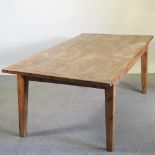 A rustic pine dining table, of large proportions,