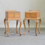 A pair of French style walnut bedside tables,