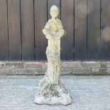 A reconstituted stone garden figure of a pixie,