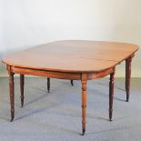 A George III hardwood D end dining table, on ring turned legs,