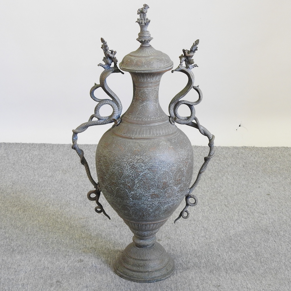 An early 20th century Indian brass urn and cover,