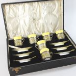 An early 20th century Aynsley bone china coffee set, with pierced silver mounts,