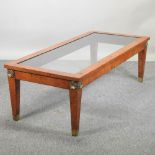 A French style walnut and gilt mounted glass top coffee table,