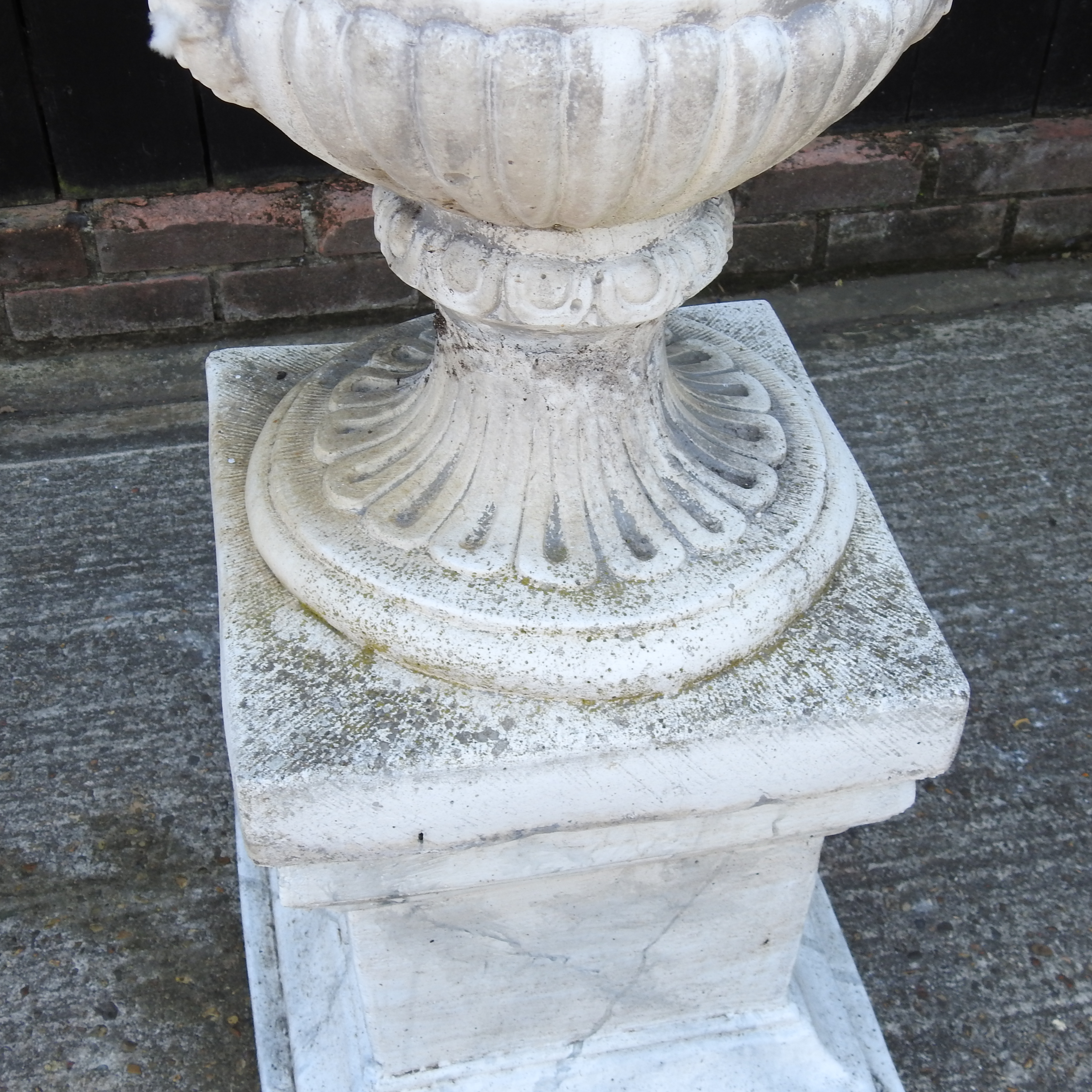 A weathered reconstituted stone faux marble garden urn, on a pedestal base, - Image 2 of 13